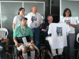 SPAIN Rehab. participants presenting Sam with a t-shirt